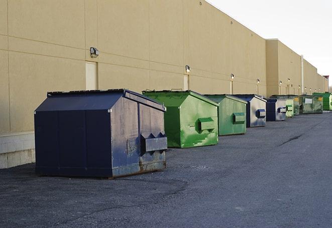 metal waste containers sit at a busy construction site in Bradbury, CA